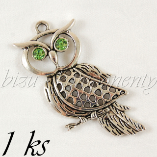 Sova z profilu se zelenýma očima, stříbrná barva